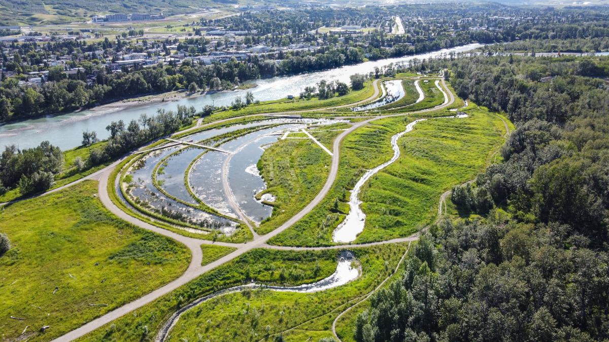 Aerial view of Dale Hodges Park on the edge of Bow River in Calgary with stormwater treatment areas adjacent to urban area