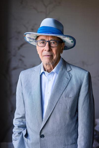 Isadore Sharp waring a blue hat