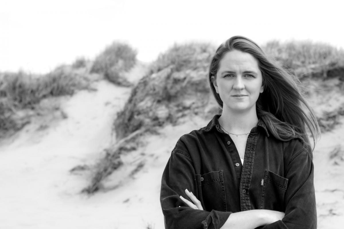 Zannah Matson in front of beach dune