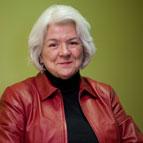 Wendy Shearer sitting with green background