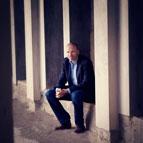 Andrew Anderson sitting against wall