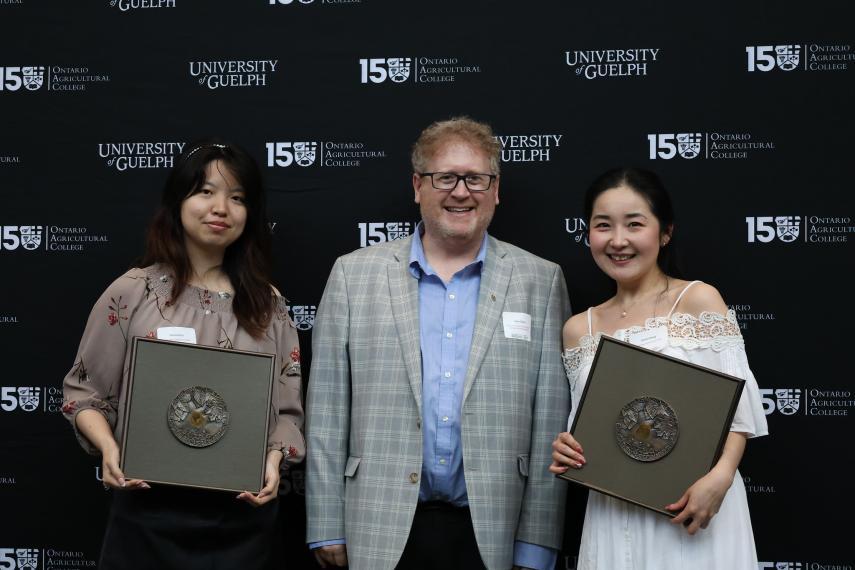 Students holding awards