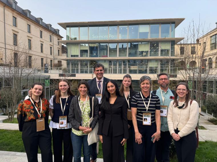 A group of people standing together in front of the Science Po building