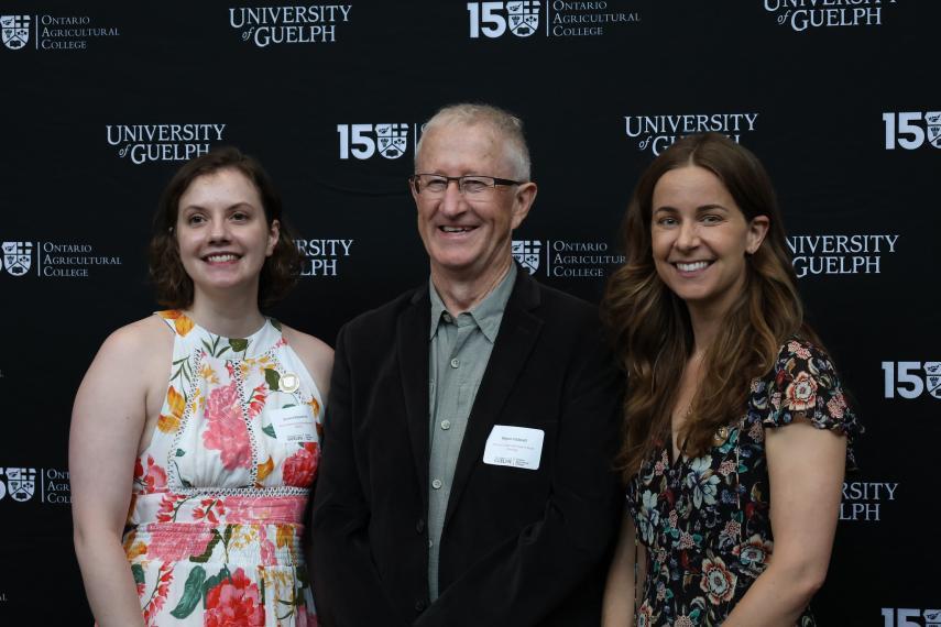 Two students standing with Dr. Wayne Caldwell