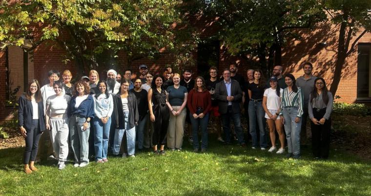 students gathered together at an outside courtyard