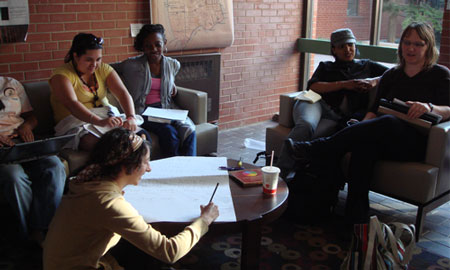 CDE students sharing ideas around the coffee table