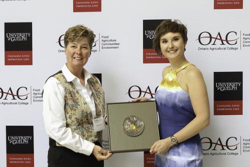 Linda Irvine presenting Chanasyk Medal to Corin Latimer