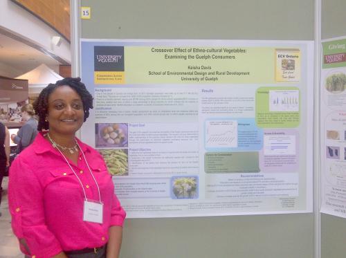 Keisha Davis stands in front of her winning research poster