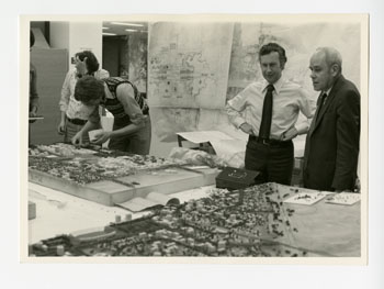 Macklin Hancock looking at drawings at Project Planning Associates Office