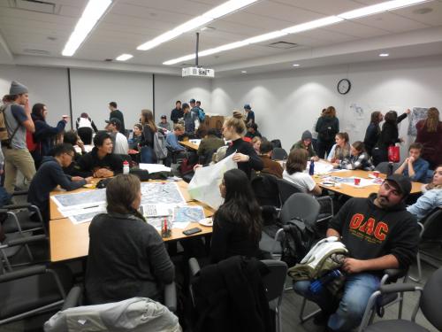 Landscape Architecture Students sitting around tables participating in design charrette