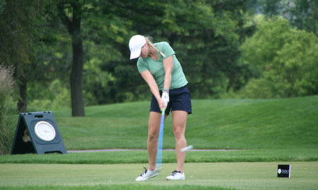 Christine Fraser putting golf ball on the golf green