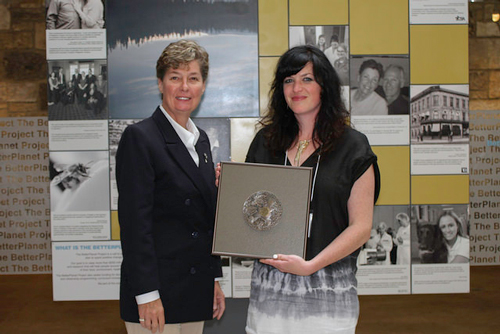 Linda Irvine presents Heather Schibli with medal