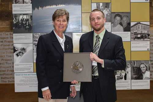 Linda Irvine presents Jonathan Behnke with medal