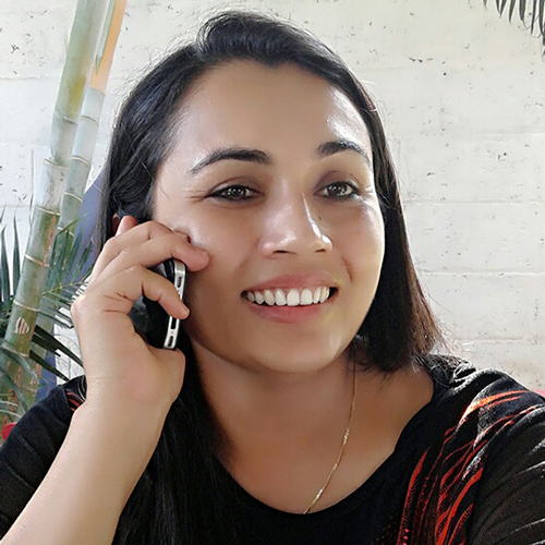 Head shot of Rachana Devkota talking on cell phone