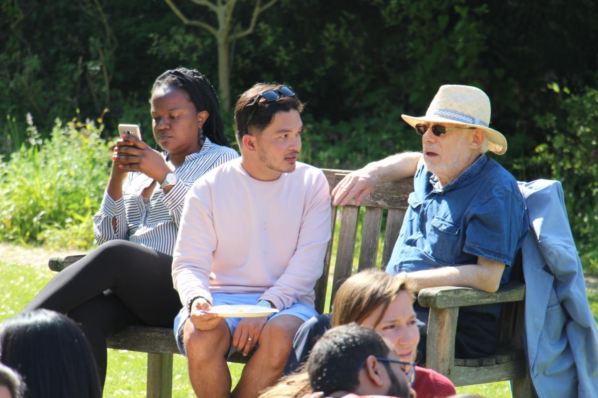 Students sitting on park bench