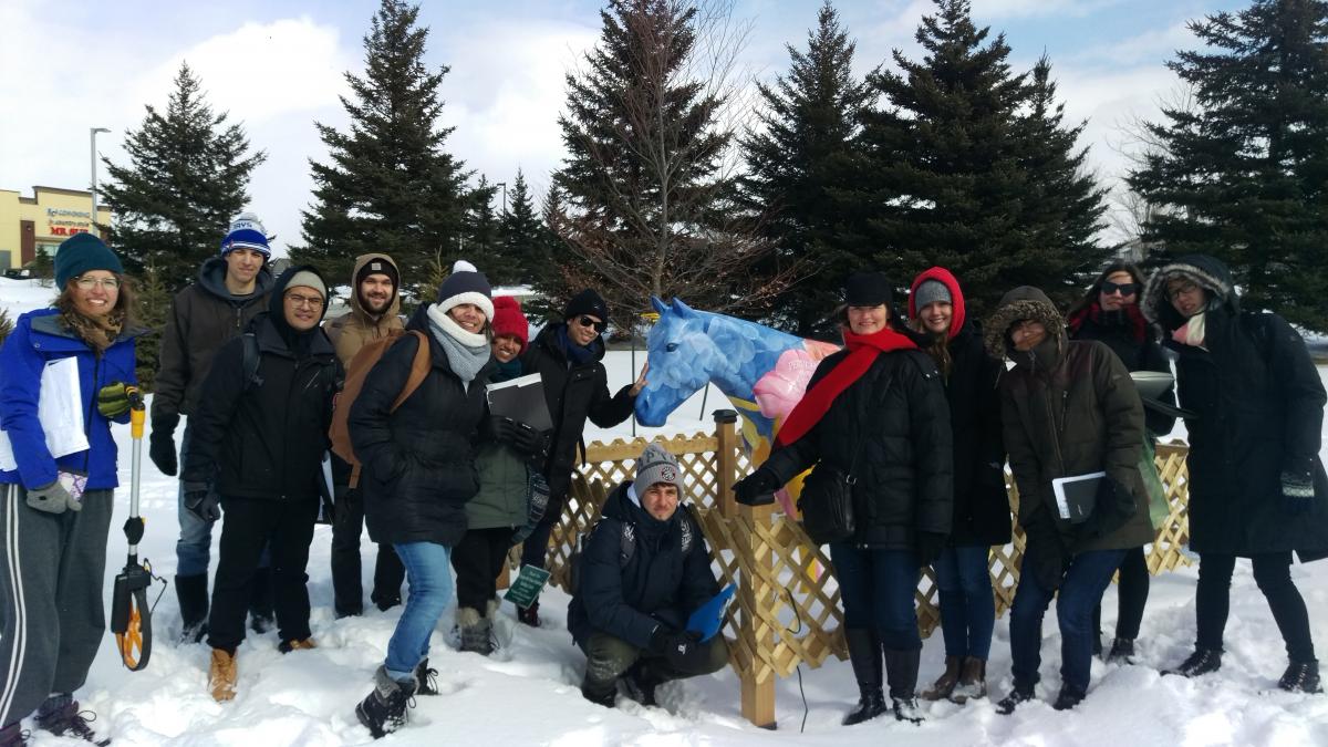 students gathered around hospital gardens in the snow