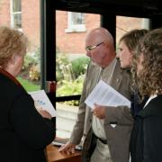 Mary Ferguson (left) sharing information to conference attendees